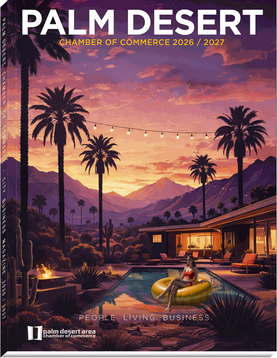 The Chamber Connection 2026/2027 — Palm Desert Area Chamber of Commerce city business magazine. Cover shows a desert sunset over the mountains with palm trees, a mid-century modern home, and a woman working on a laptop from a pool float.